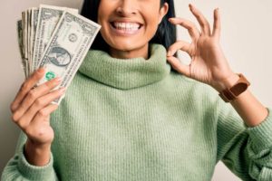woman-holding-cash-ok-sign-1-1024x683